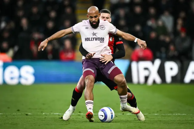 Brentford's French-born Cameroonian striker #19 Bryan Mbeumo (front) fights for the ball with Bournemouth's Hungarian defender #03 Milos Kerkez