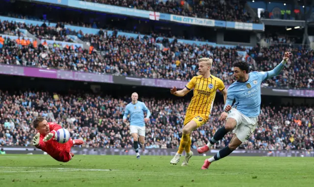 Brighton & Hove Albion's Bart Verbruggen saves from Manchester City's Omar Marmoush