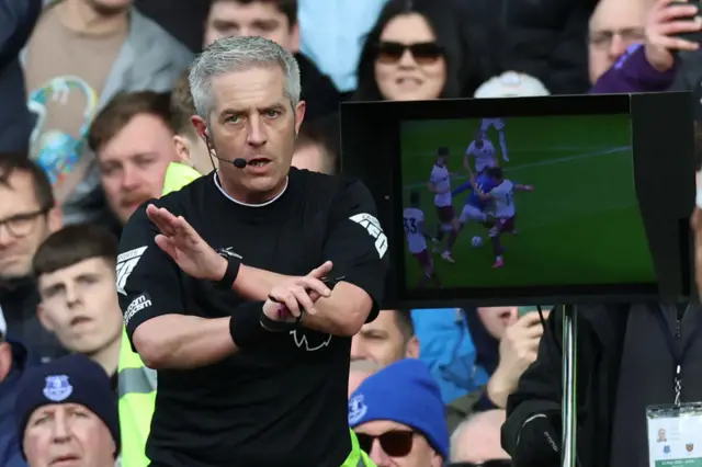 English referee Darren Bond rules out a penalty