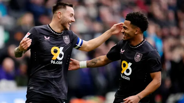 Burnley's Josh Brownhill celebrates scoring the opener at Swansea