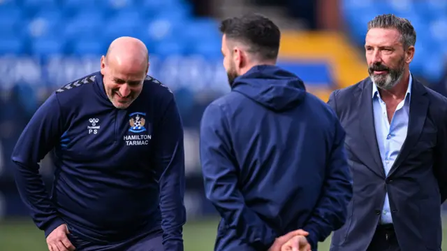 Derek McInnes and his coaching staff pre-match