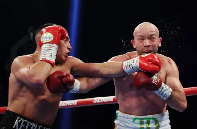 Nick Ball punches TJ Doheny during the WBA World Featherweight title fight