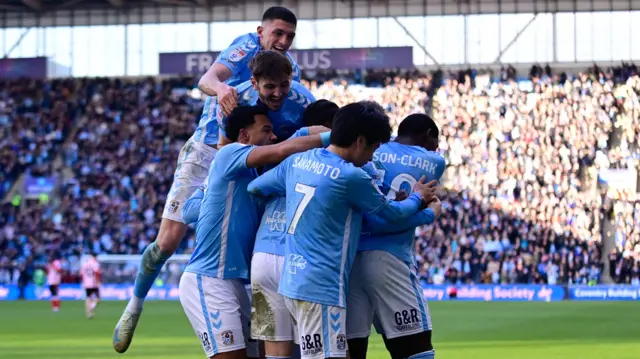 Coventry players celebrate with Haji Wright