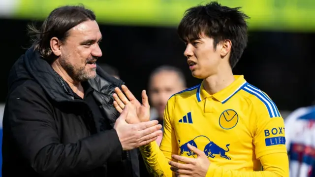 Daniel Farke with Leeds midfielder Ao Tanaka at full-time