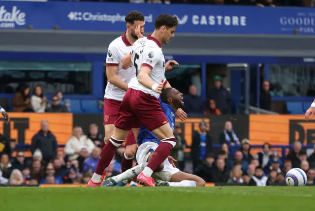 Everton's Beto is brought down in the penalty area,