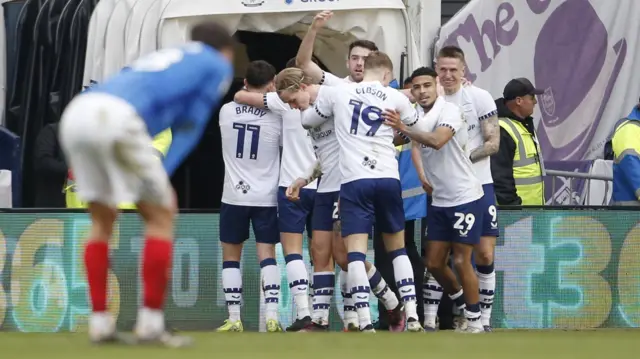 Preston players celebrate their second goal against Portsmouth