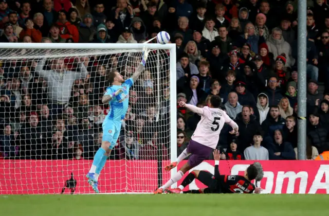 Mark Flekken of Brentford saves the shot of Evanilson of AFC Bournemouth