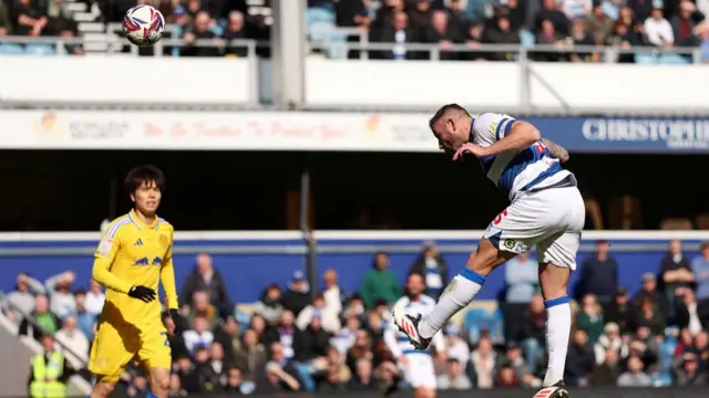 Steve Cook heads QPR's second against Leeds