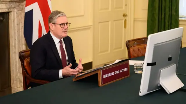 Keir Starmer in front of monitor