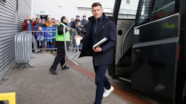 Portsmouth manager John Mousinho arrives at Deepdale