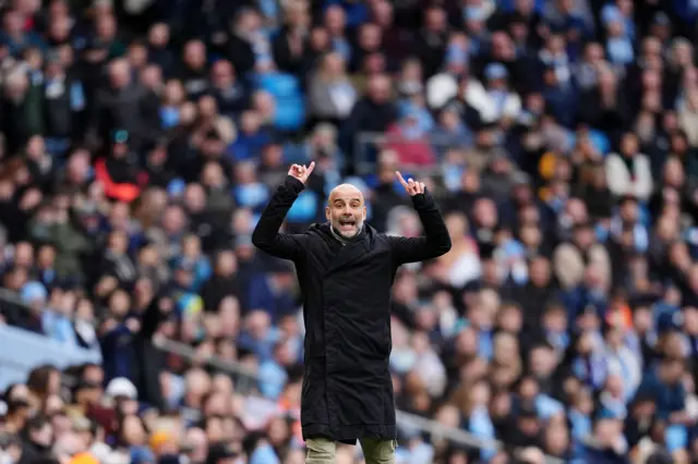 Manchester City manager Pep Guardiola gestures on the touchline