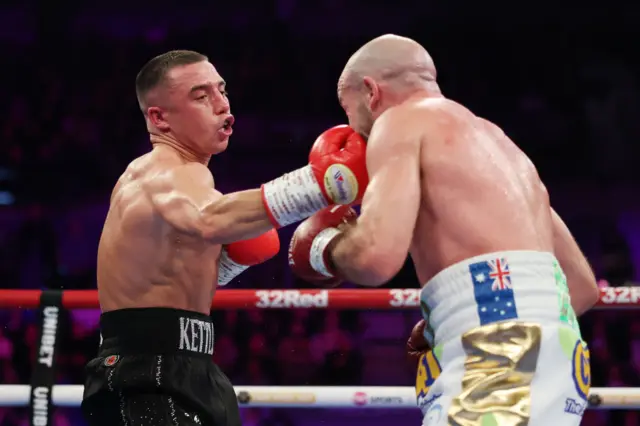 Nick Ball punches TJ Doheny during the WBA World Featherweight title fight