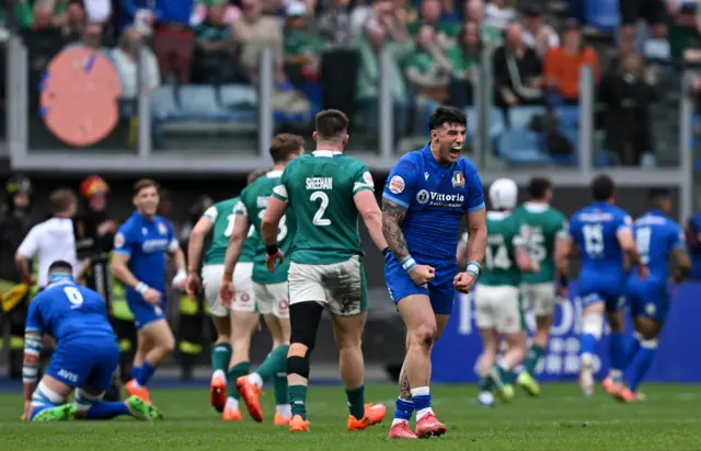 Italy celebrate their Monty Ioane's try