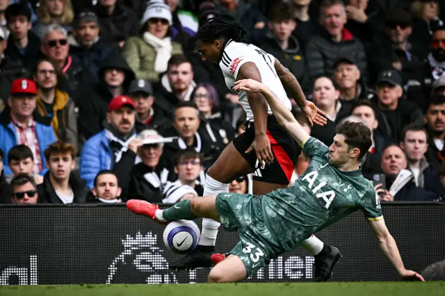 Adama Traore (rear) fights for the ball with Tottenham Hotspur's Welsh defender #33 Ben Davies