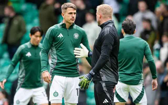 Maik Nawrocki in conversation with Celtic goalkeeper Kasper Schmeichel