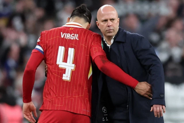 Liverpool's Virgil van Dijk and manager Arne Slot look dejected