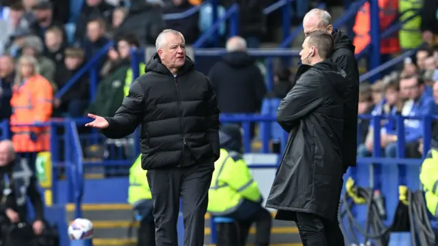 Sheffield United boss Chris Wilder in discussion with the fourth official on the touchline