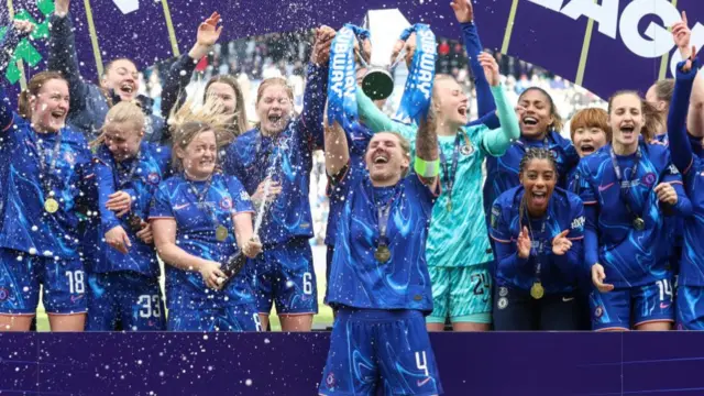 Chelsea celebrate winning the League Cup with the trophy