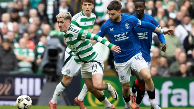 Celtic's Luke McCowan is closed down by Rangers' Nico Raskin