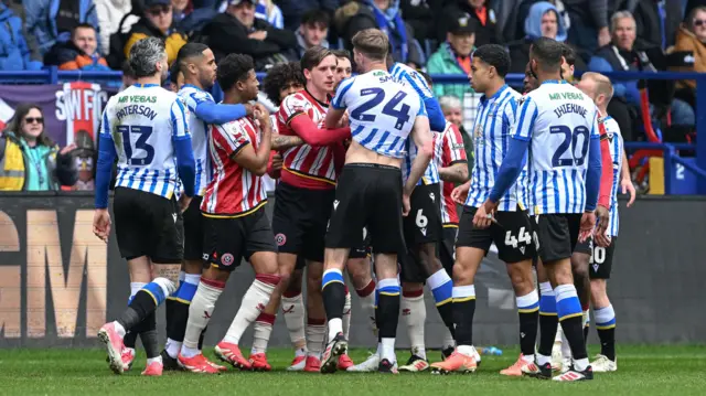 Players from Sheffield United and Sheffield Wednesday confront each other