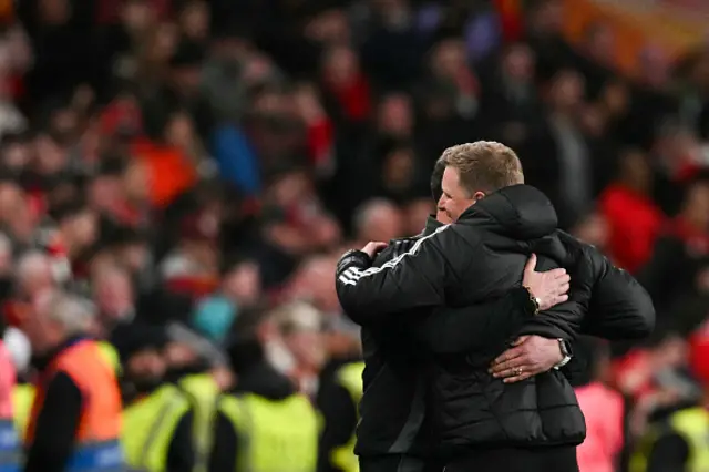 Newcastle United's English head coach Eddie Howe (R) celebrates