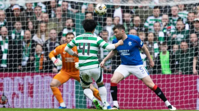 Reo Hatate has a shot for Celtic against Rangers