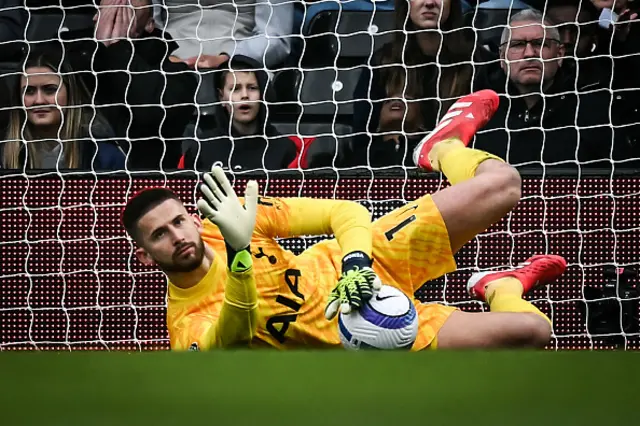 Guglielmo Vicario stops the ball to make a save