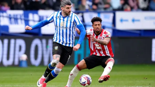 Sheffield Wednesday's Callum Paterson tries to find a way past Rhian Brewster