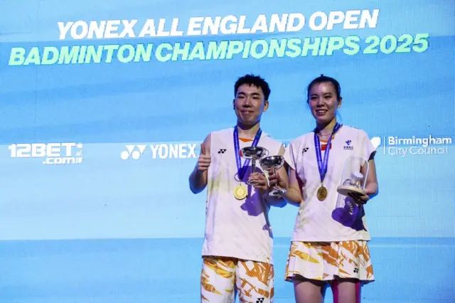 Winners China's Guo Xin Wa (L) and China's Chen Fang Hui (R) celebrate with their trophy during the podium ceremony for the Mixed Doubles Final