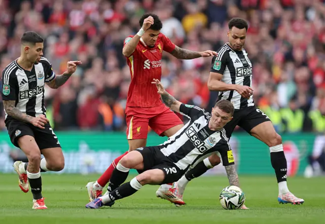 Kieran Trippier of Newcastle United tackles Luis Diaz