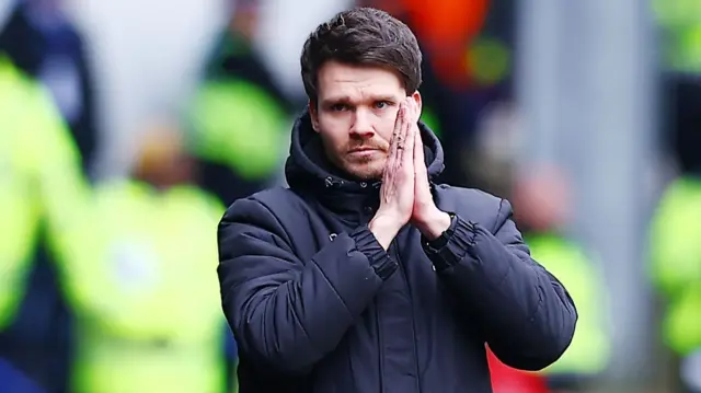 Sheffield Wednesday boss Danny Rohl puts his hands together in a prayer motion