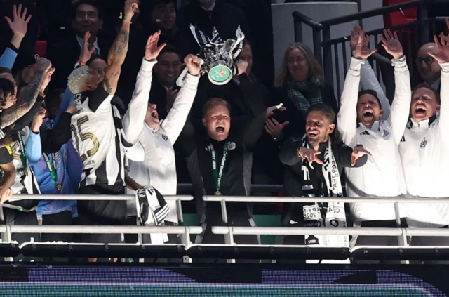 Newcastle United manager Eddie Howe lifts the trophy