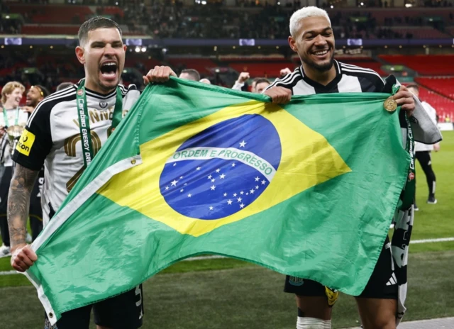 Newcastle United's Bruno Guimaraes (L) and Joelinton celebrate