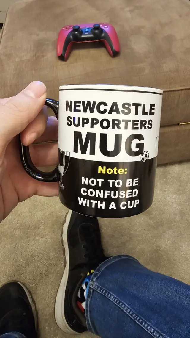 Newcastle fan with mug