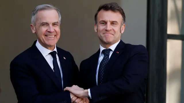 French President Emmanuel Macron welcomes Canadian Prime Minister to the Elysee Palace in Paris