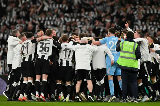 Newcastle players in a huddle at Wembley