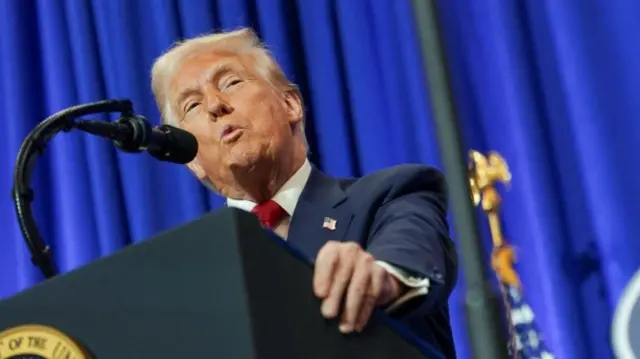 US President Donald Trump speaks during his visit to the Department of Justice