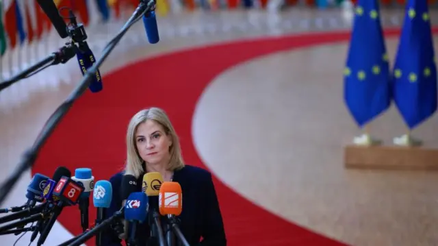 Austrian Foreign Minister Beate Meinl-Reisinger speaks to the media during a European Foreign Affairs Council at the EU headquarters in Brussels