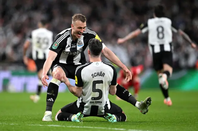 Dan Burn and Fabian Schar celebrate