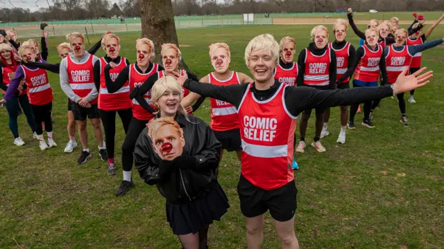 Sam & Danni with a group of runners wearing Jamie Laing wigs and masks