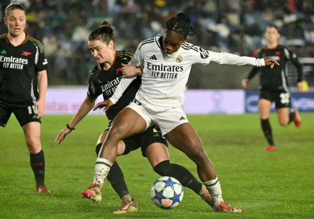 Arsenal's US defender #02 Emily Fox (L) and Real Madrid's Colombian forward #18 Linda Caicedo fight for the ball.