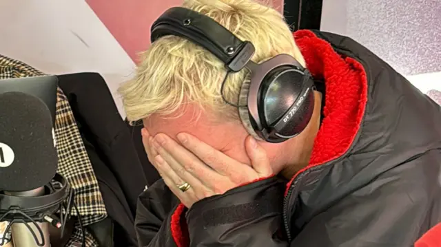 Jamie Laing with his head in his hands