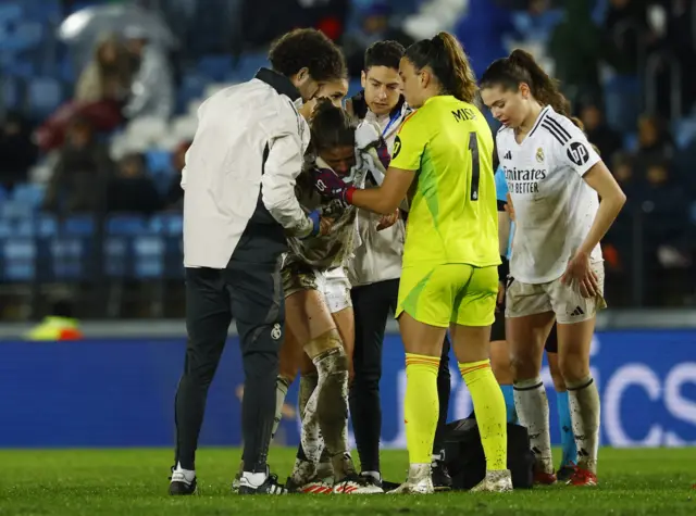 Real Madrid's Melanie Leupolz receives medical attention after sustaining an injury.