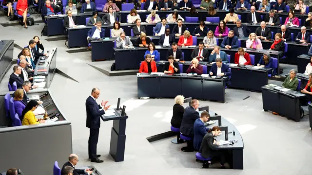 Friedrich Merz address lawmakers