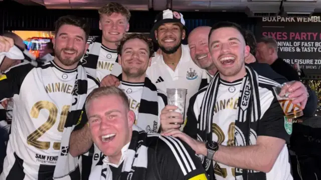 Alan Shearer and his son Will joined other Newcastle fans to pose with midfielder Joelinton at Boxpark on Wembley Way as the players partied with supporters after the game