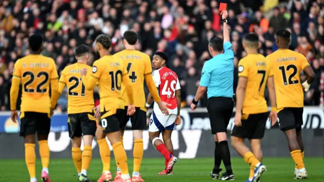 Arsenal's Myles Lewis-Skelly being sent off against Wolves