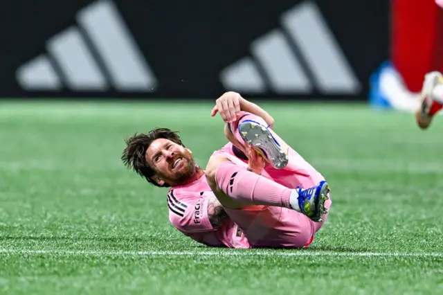 Lionel Messi on the floor injured