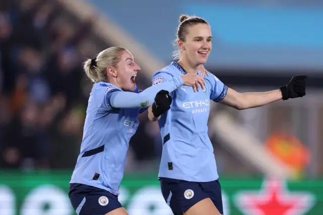 Vivianne Miedema of Manchester City celebrates with Laura Coombs