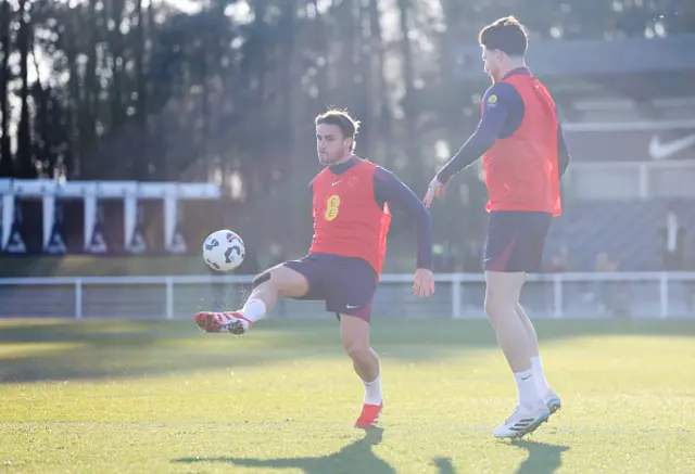 Taylor Harwood-Bellis of England controls the ball