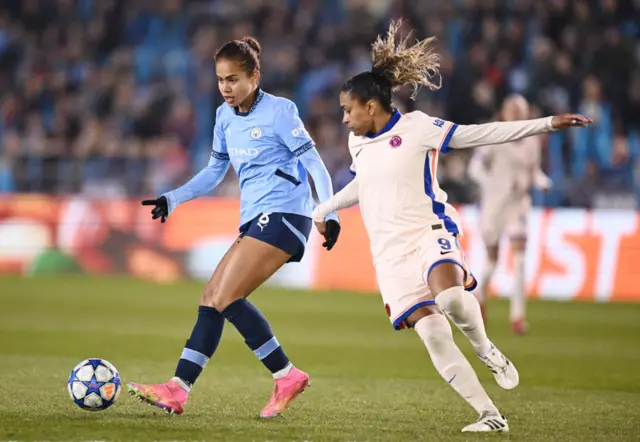 Mary Fowler of Manchester City is challenged by Catarina Macario.